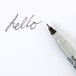 The black Sharpie Twin-Tip Permanent Marker writing "hello" in fine print and "calligraphy" in ultra-fine print.