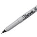 A close-up of a Sharpie Ultra-Fine Point black permanent marker with white lettering.