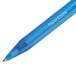 A close-up of a Paper Mate InkJoy 100 RT blue pen with a blue barrel.