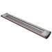 A Hatco antique copper infrared food warmer with a long rectangular light fixture above a wooden shelf.
