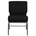 A Flash Furniture black church chair with metal legs and a metal rack.