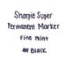 A close-up of writing in black Sharpie.