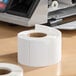 A roll of blank white thermal labels measuring 2 3/16 inches by 1 5/8 inches, containing 750 labels per roll.