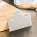 A Matfer Bourgeat stainless steel cake comb on a counter.
