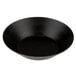 A close-up of a black Matfer Bourgeat tartlet/quiche mold with a white background.