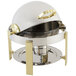 A silver stainless steel and brass Bon Chef chafer with a lid on a table.