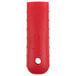 A red silicone handle holder with a white circle on it.