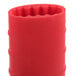 A red silicone cylinder with a hole in the middle.