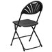 A Flash Furniture black plastic folding chair with a black fan back.