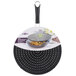 A black Mastrad silicone splatter screen over a frying pan.
