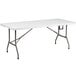 A white rectangular Flash Furniture plastic folding table with metal legs.