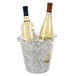 A Franmara clear acrylic wine cooler filled with ice and two bottles of wine.