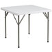 A Flash Furniture white square plastic folding table with metal legs.