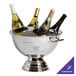 A Franmara silver wine cooler with three bottles of wine in it.
