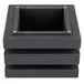A black rectangular object with square holes in the sides.