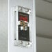 A close-up of a digital temperature display on a Traulsen refrigerator.
