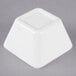 A white square Vollrath melamine bowl.