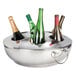 A Franmara silver metal wine cooler holding several bottles of wine.