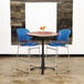 A table with blue Safco Reve bistro chairs.