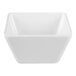 A small white square melamine bowl with a 20 oz. capacity.