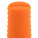 An orange cylindrical silicone handle holder with a cut out design on a white background.