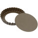 A round brown metal tart pan with a fluted edge and removable bottom.