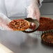 A close-up of a pecan tart in a Gobel fluted tin.