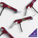 A customizable waiter's corkscrew with a burgundy handle and metal components.