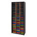 A Safco black steel file organizer with many colorful folders on the shelves.