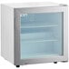 An Avantco white countertop display freezer with a glass door.