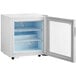 An Avantco white countertop display freezer with a swing door.