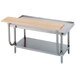 A stainless steel work table with a wood cutting board on it.