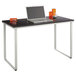 A black Safco steel workstation with a laptop on it.