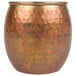 A close-up of an American Metalcraft Hammered Antique Copper Moscow Mule Tumbler.