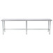 An Advance Tabco stainless steel work table with an open base and metal legs.