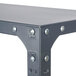 A Safco dark gray steel shelving unit with rivets and screws.