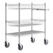 A metal shelf with black wheels.