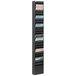 A black steel Safco magazine display rack with magazines on the shelves.