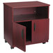 A mahogany Safco laminate machine stand with a cabinet with two doors open.