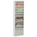 A gray Safco steel magazine display rack with several magazines on it.
