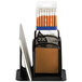 A black metal Safco Onyx 3 compartment desktop organizer holding pencils.