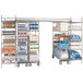 A large Metro chrome-plated metal shelving unit with many shelves holding many items.