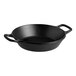 A Lodge black cast iron pan with two handles.