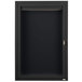 A black metal cabinet with a hinged locking door.