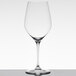 A close-up of a clear Spiegelau Bordeaux wine glass.