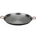 A Matfer Bourgeat carbon steel paella pan with handles.