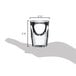 A hand holding a Libbey fluted shot glass with measurements on it.