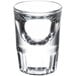 A close up of a Libbey fluted shot glass with a small bubble in it.