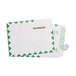 A stack of white U.S. Postal Service First Class Mailers with a green border.