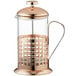 An Acopa glass coffee press with a metal handle and copper lid.